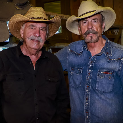 two men in cowboy hats
