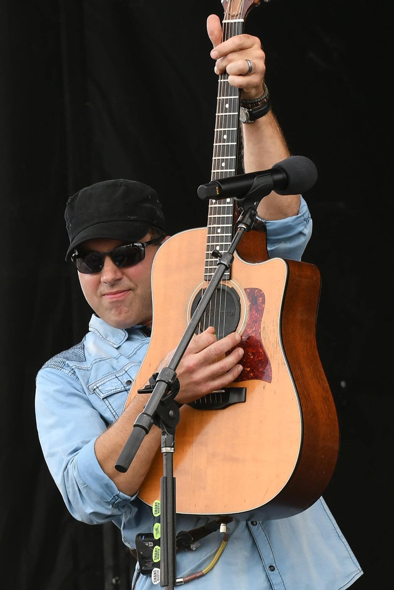 man holding guitar