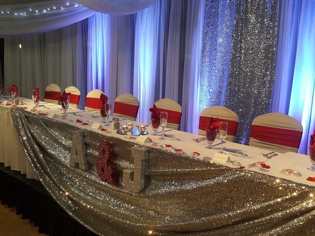 ballroom head table with sequin fabric draping