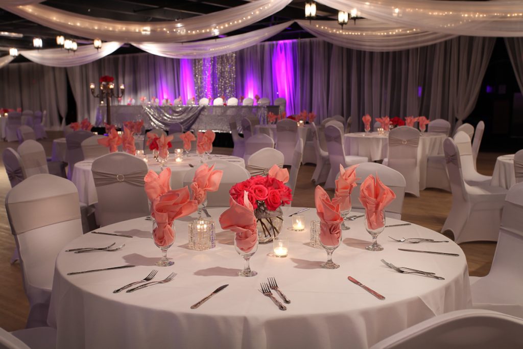 Event reception with coral napkins and light draping
